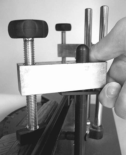 Figure E-6: Release the clamp foot by pressing up on the quick release lever
